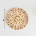 Detailed top view of 21cm woven heat resistant round table mat with spiral pattern - Large Size (21cm)