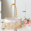 Detailed view of golden iron flower basket with lace trim and size markings - Oval Straight Handheld Small
