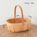 Detailed view of handmade oval wooden woven basket with sturdy handle and rural style - Wood Chip Oval Basket Small 27cm