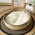 Handwoven round cat bed with dark green trim and soft plush cushion for all seasons - Army Green Nest + White Cushion