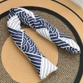 Blue and white patterned long bolster pillow for babies and adults on woven mat - Blue Pillow
