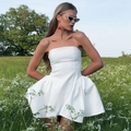 Elegant white strapless mini dress with fitted waist and flared A-line skirt for summer wear - S / White
