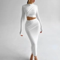 Detailed view of white two-piece set featuring ruched cropped top and fitted maxi skirt - S / White
