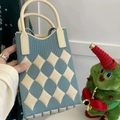 Detail of blue and white argyle knit handbag with thick cylindrical carry handle - Rhombus Pattern Light Blue