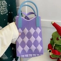 Detail view of purple argyle knitted phone bag with contrast sky blue handle - Rhombus Pattern Purple