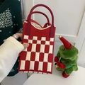 Detail of red and white checkered knit mini phone bag with soft curved top handle - Checkerboard Red