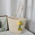 Woven straw tote bag in creamy white with floral crochet charms for summer beach trips - Off-white with Green Flowers