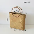 Detail der gewebten Strohhandtasche mit genauen Abmessungen und hochwertiger Naturtextur - Stroh Geschenkbeutel 30*7*25