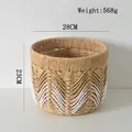 Detailweergave van de ronde gevlochten opbergmand met een wit golfpatroon en afmetingen - Klein 28*23