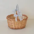 Detail view of oval rattan picnic basket with dimensions and blue gingham ribbon handles - Oval Medium (23cm) / Blue Checkerboard