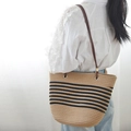 Natural woven tote bag with black stripes and brown leather straps for summer vacations - Khaki Black Striped