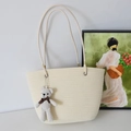 Cream-white woven tote bag with slim leather straps and matching bear charm decoration - Off-White And Pineapple Bear Charm