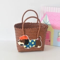 Brown handwoven basket tote bag featuring a cute cartoon puppy patch with orange hat - Short Handle Coffee Color - Cap Dog