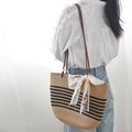 Khaki straw tote bag with black stripes and a white lace floral ribbon bow detail - Khaki And Black Striped And Ribbon