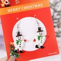 Orecchini a forma di pupazzo di neve su carta regalo rossa di Buon Natale - Pupazzo di Neve