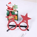 Close-up of red glitter Christmas star glasses with a gold Merry Christmas nameplate - Red Star Glasses