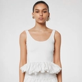 Close-up of a white sleeveless square neck top featuring a dramatic ruffled peplum waist - S / White