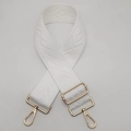 Detail of adjustable 5cm wide white canvas strap with gold metal hooks and geometric weave - Gold / White