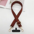 Detail of adjustable woven ethnic strap with gold metal hooks and mobile phone pad - Red Yellow Black Wave Pattern (Style 1)