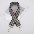 Close-up of green and white diamond pattern wide woven bag strap with gold metal buckle - Light Gold Hook / Black Matcha Green