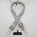 Detail of adjustable gray woven crossbody phone strap with gold hardware and connector - T-Shaped Gasket / Beige Grey