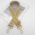 Detail view of woven ethnic style bag strap with diamond pattern and gold metal buckles - Light Gold Hook / Beige Yellow Edge Gray