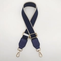 Detail of adjustable woven canvas bag strap in navy blue with gold metal hardware - Blue with Beige Edge and Blue Leather