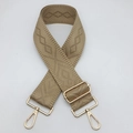 Detail of adjustable khaki woven shoulder strap with gold hardware and geometric pattern - Khaki