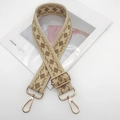 Macro shot of ethnic diamond pattern woven bag strap with golden metal hardware adjusters - Light Gold Hook / Beige Apricot Khaki