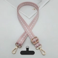 Detail of pink woven crossbody phone strap with gold metal hooks and connector pad - T-Shaped Gasket / Pink