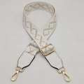 Detail of adjustable wide woven shoulder strap with gold metal hooks and white leather ends - White Border Apricot + White Leather