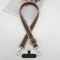 Detail of geometric pattern phone strap with golden metal buckles and T-shaped connector - Beige Edge Tan With T-Pad