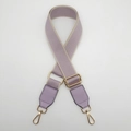 Close-up of adjustable lavender canvas bag strap with gold metal buckles and purple leather - Light Purple with Light Purple Leather