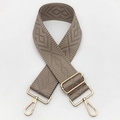 Macro detail of 5cm wide adjustable canvas strap with rhombus embroidery and gold hardware - Grey Khaki