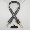 Detailed view of adjustable woven phone strap with gold metal buckles and gray pattern - T-Shaped Gasket / Dark Gray