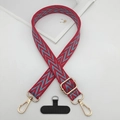 Detail of red and blue braided phone strap with gold rotating clasp and adjustment buckle - Red & Blue Herringbone Style (Style 6)
