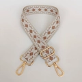 Close-up of geometric diamond woven shoulder strap with gold-tone metal lobster clasps - Light Gold Hook / Beige White Khaki