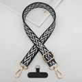 Close-up of durable black and white patterned phone strap with gold metal buckles - Black & White Herringbone Style (Style 8)