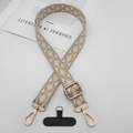 Macro shot of adjustable ethnic jacquard phone strap with gold lobster clasps and hardware - Apricot With T-Pad