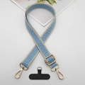 Detail view of blue geometric woven phone strap with gold hooks and adjustment buckle - Beige Edge Light Blue With T-Pad