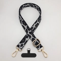Close-up of leopard print phone strap with gold metal hooks and adjustable buckle - Leopard Black Dark Gray + T-Plate