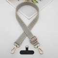 Close-up of adjustable grey geometric embroidered phone strap with gold metal hardware - Beige Edge Gray With T-Pad