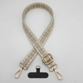 Detail view of retro geometric diamond pattern phone strap with gold metal hooks - Style 10