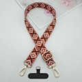 Detail of geometric diamond pattern phone lanyard with gold swivel hooks and black patch - Orange Brown White Pink Rhombus (Style 12)