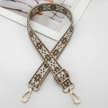 Close-up of ethnic geometric embroidered bag strap with polished gold metal hardware - Silver Hook / Beige Base Dark Khaki