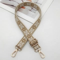 Close-up of ethnic geometric woven strap with golden metal lobster clasps and buckles - Cream Apricot
