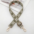 Close-up of green and white geometric ethnic embroidery on adjustable handbag strap - Silver Hook / Beige Army Green