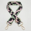 Close-up of wide colorful patterned strap with pink and green accents and gold hardware - Pink Green Black Spot (C41)