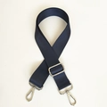 Close-up of durable navy blue nylon shoulder strap with silver rotating metal hooks - Blue with Silver Hardware