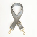 Macro detail of wide grey nylon bag strap with herringbone weave and gold swivel hooks - Gray with Gold Hardware